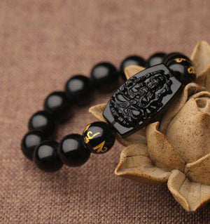 Bracelet amulette porte-bonheur bouddha sculpté en obsidienne noire